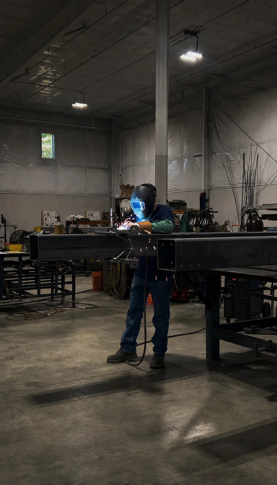 Welder working under a bright arc flash