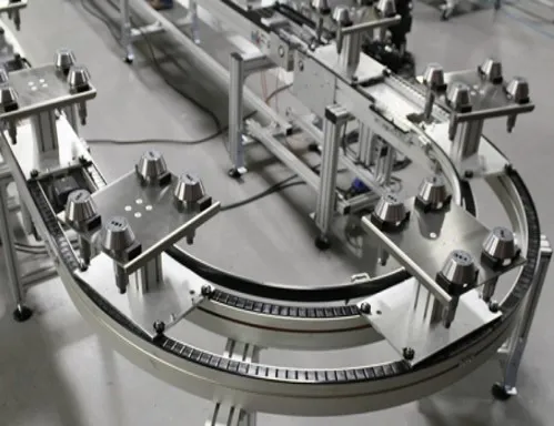 Work fixture pallet conveyor with tooling plate