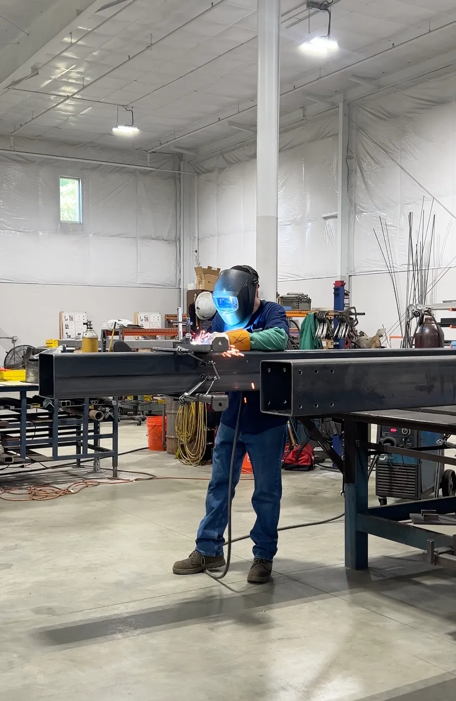 Technician working at a warehouse workbench