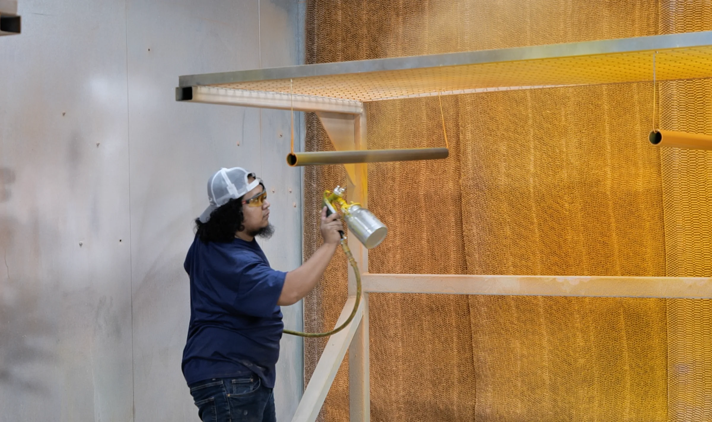 Technician finishing a fabricated conveyor component