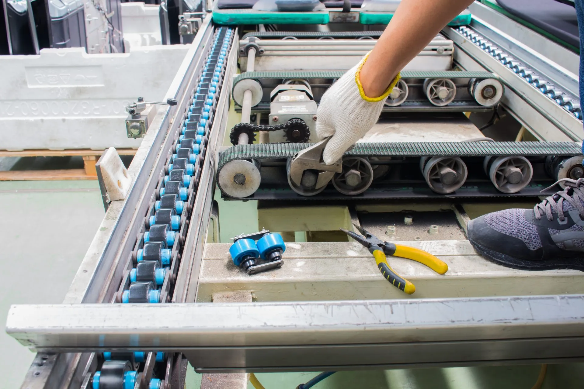 Technician servicing a roller conveyor line