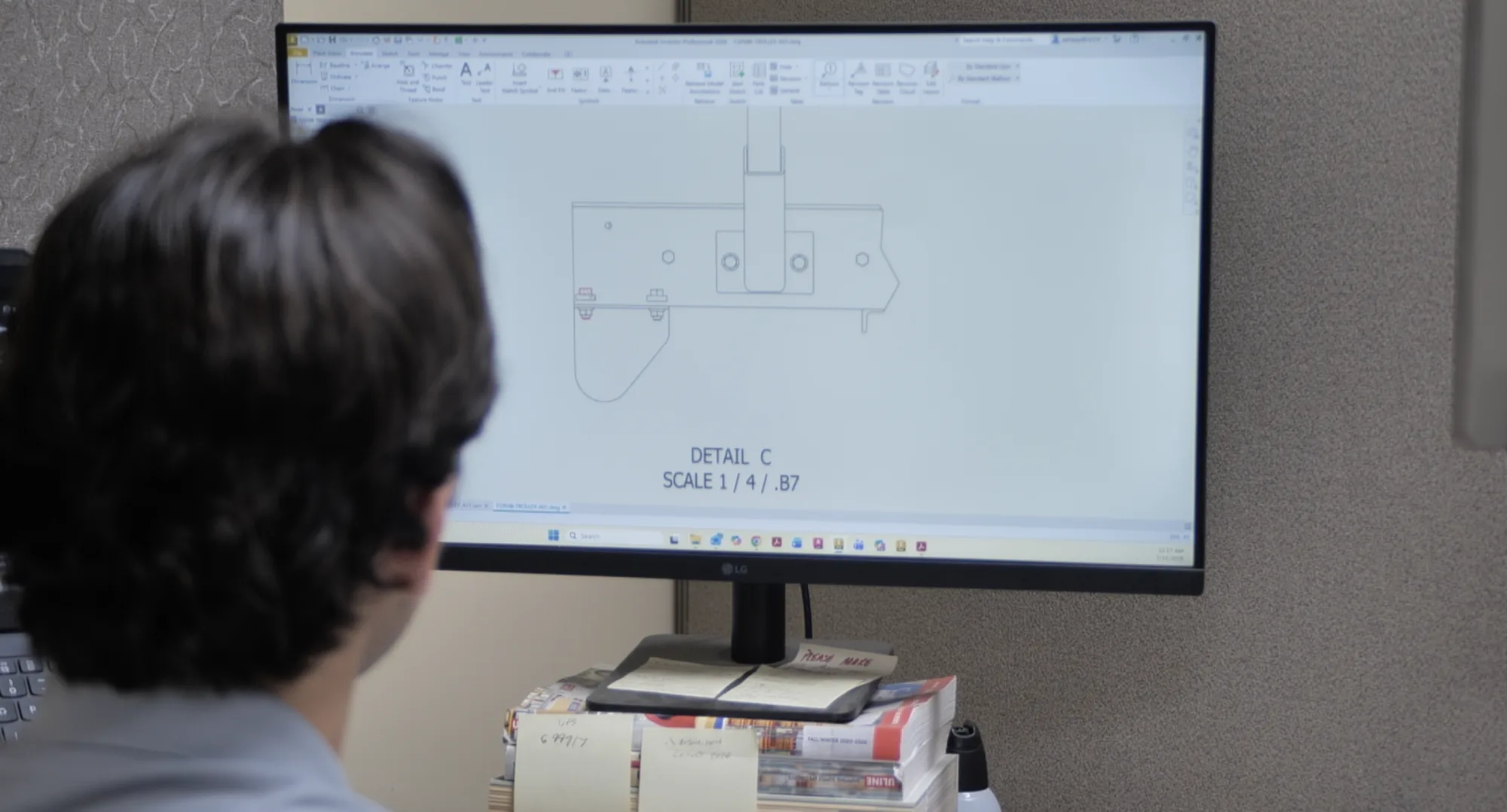 Conveyability engineer reviewing a detailed system drawing