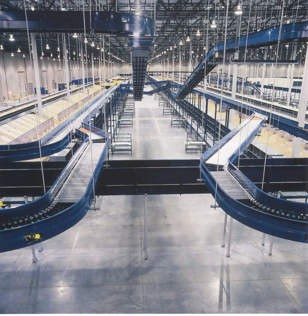 Sortation conveyors running through a distribution warehouse